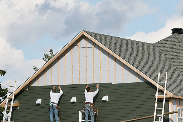 Professional Siding technician working in Erie, PA